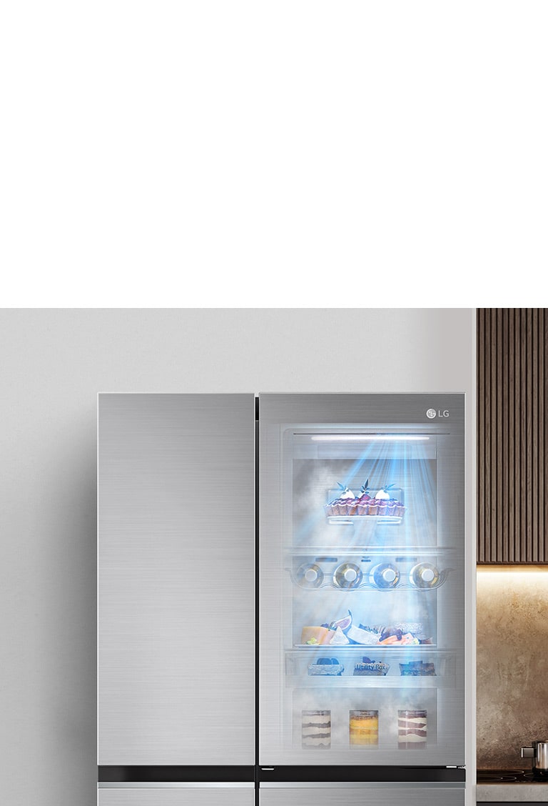 The front view of a black InstaView refrigerator with the light on inside. The contents of the refrigerator can be seen through the InstaView door. Blue rays of light shine down over the contents from the DoorCooling function.