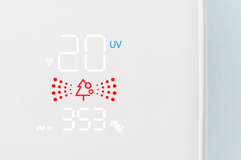 A close up of the air quality panel with red lights indicating bad quality air.