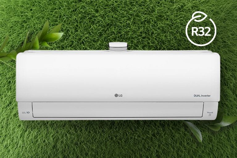 The LG Air conditioner is installed on a wall of grass. The R32 logo for energy efficiency is in the upper right corner.