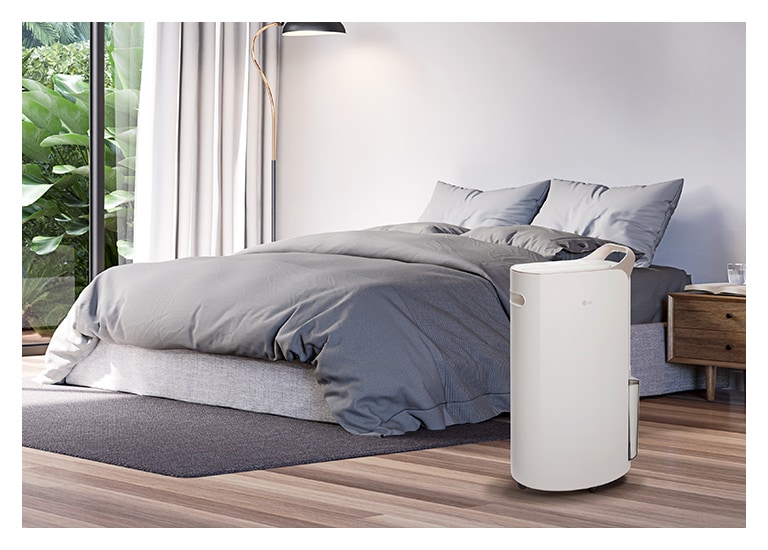 It shows calming beige color LG Puricare™ Dehumidifier is placed in a modern livingroom.