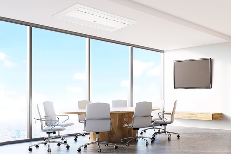 An LG 1 Way Ceiling Mounted Cassette decorates a conference room ceiling, harmonizing with eight chairs surrounding a grand table at the room's heart.