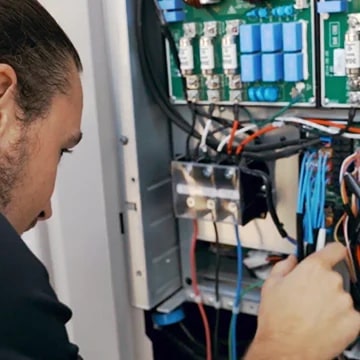 A engineer is checking the Multi V outdoor unit.