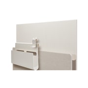 Posé seen from the back facing right with Cable & Accessory Organizer and hook hovering over the media shelf.
