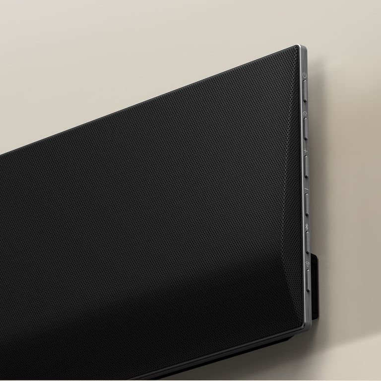 A close-up image of the LG soundbar against the wall.