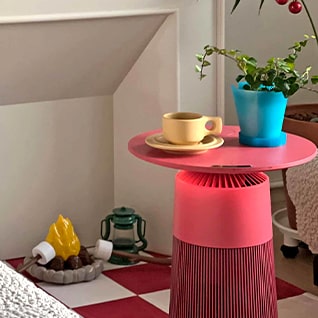 Products are placed in a room with colorful interiors. Coffee cups and pots are placed on top, serving as an interior accessory.