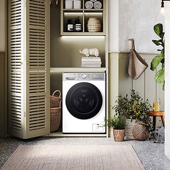 Biała pralko-suszarka 13/7 kg LG F4D37952W z czarnymi drzwiami, w nowoczesnej i przytulnej pralni.