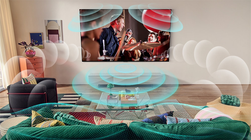 Zdjęcie telewizora LG OLED w pomieszczeniu przedstawiające scenę z koncertu. Chmurki przedstawiające wirtualny dźwięk przestrzenny wypełniają przestrzeń.