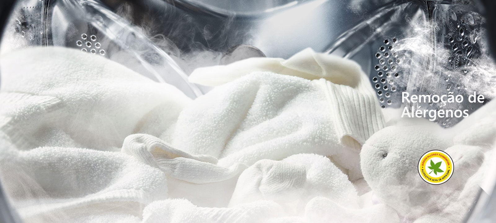 A soft white robe and stuffed animal are shown with steam in the drum of the washing machine.	