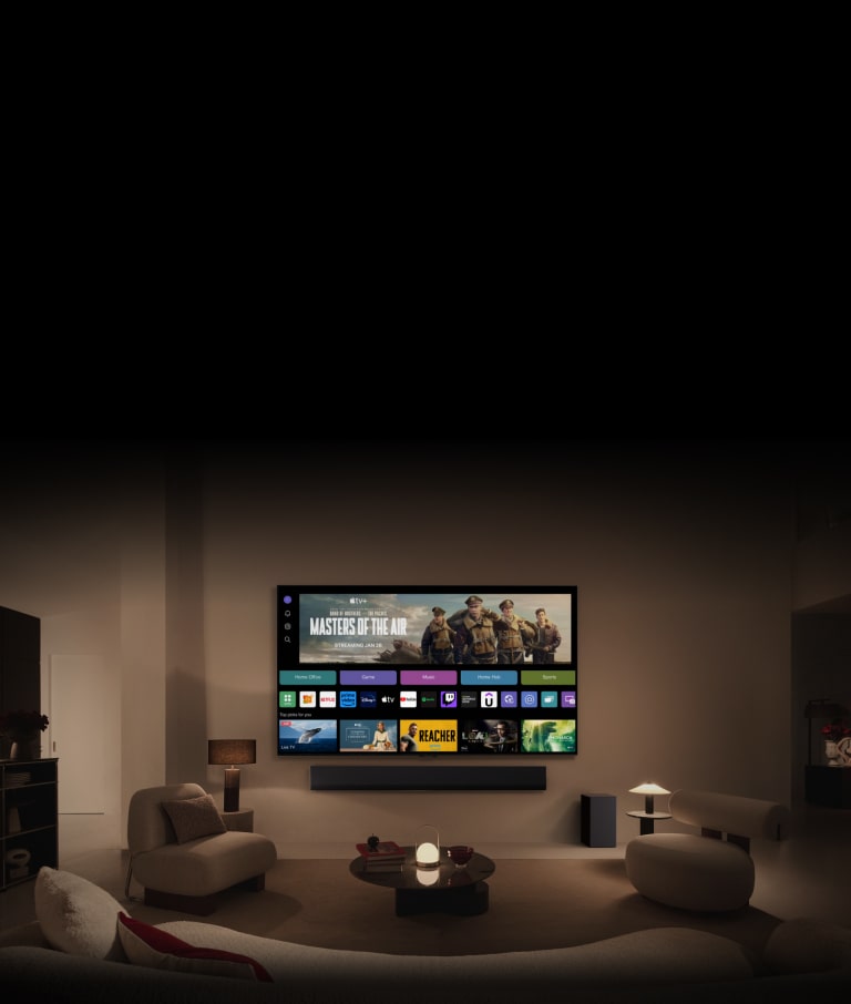 صورة مقرّبة لشاشة تلفزيون LG TV تُظهر أزرار Home Office وGame وMusic فوق لافتة لـ Masters of the Air، يتم تكبيرها لتظهر التلفزيون مثبتًا على حائط في غرفة المعيشة. تُعرض الشعارات التالية على شاشة التلفزيون في الصورة: LG Channels وNetflix وPrime Video وDisney TV وApple TV وYouTube وSpotify وTwitch وGeForce Now وUdemy.