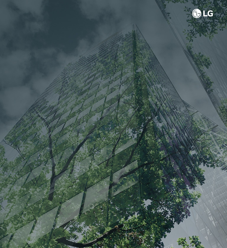 An image of a modern high-rise building intertwined with greenery, emphasizing its environmentally sustainable design elements.