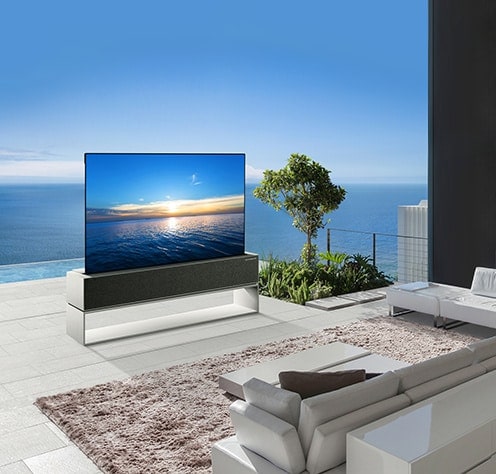 LG SIGNATURE rollable OLED TV is laid on the natural style living room with ocean view.