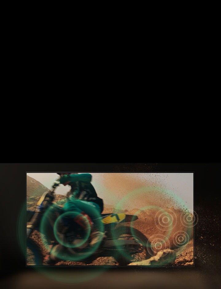 A video of a person dirt biking on red, dusty land. As they take a corner, green sound bubbles appear from the wheel.