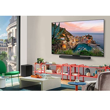 LG AI Magic Remote with the AI button highlighted. Around it are the different functionalities that a user can access from the button. AI Voice ID, AI Search, AI Chatbot, AI Concierge, AI Picture Wizard, AI Sound Wizard. The text explains that the LG AI Magic Remote completes your AI experience with a dedicated AI button and can be used like an air mouse. Just point and click.