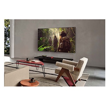 LG AI Magic Remote med AI-knappen markerad. Runt den visas de olika funktionerna som en användare kan komma åt från knappen. AI Voice ID, AI Search, AI Chatbot, AI Concierge, AI Picture Wizard, AI Sound Wizard. Texten förklarar att LG AI Magic Remote kompletterar din AI-upplevelse med en dedikerad AI-knapp och kan användas som en virtuell mus. Peka och klicka.