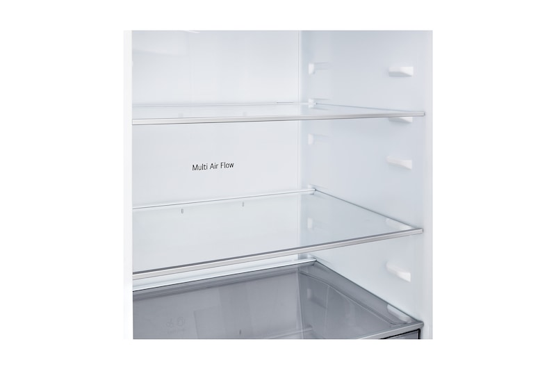 LG bottenfrys (GBBSJ10ESW) i infälld installation i hög varmt beige vägg med blåa pilar som pekar mot ovansidan och frontytorna