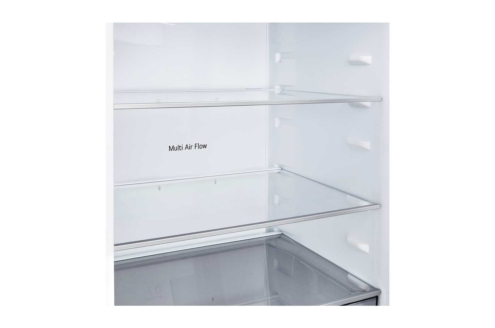 LG bottenfrys (GBBSJ10ESW) i infälld installation i hög varmt beige vägg med blåa pilar som pekar mot ovansidan och frontytorna