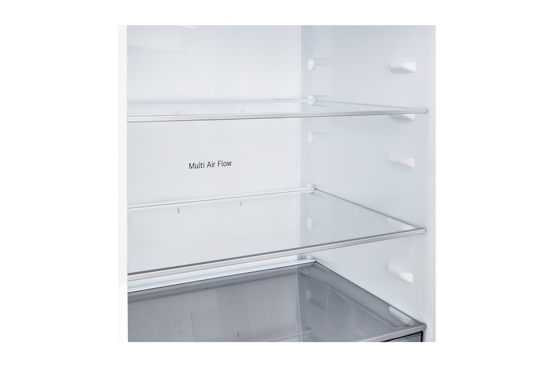 LG bottenfrys (GBBSJ10ESW) i infälld installation i hög varmt beige vägg med blåa pilar som pekar mot ovansidan och frontytorna