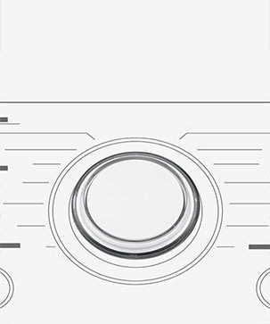 Detta är en förstorad bild av metallvredet på panelen på en tvättmaskin.