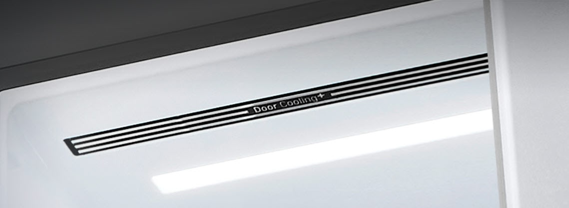 A diagonal view up into the top of the refrigerator showing the soft LED lighting.