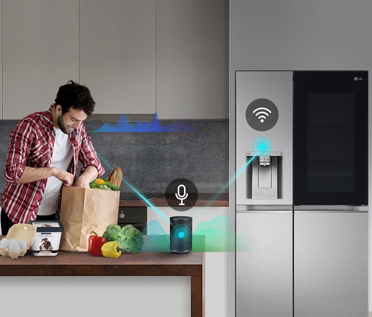 A man stands in a kitchen unloading produce from a grocery bag and speaks, shown by volume bars moving up and down near him, to the AI speaker on the counter telling it to "turn on express freeze". A line appears that goes from the man to the AI speaker which has a microphone icon above it. Then volume bars show up near the AI speaker and a line appears from the AI speaker to the refrigerator which has a Wifi icon above it.