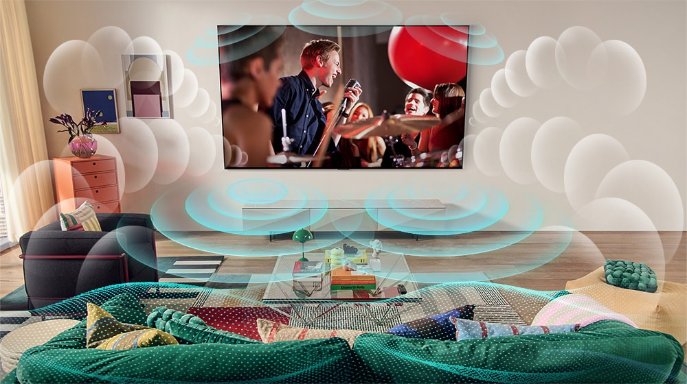 En bild på en LG OLED TV i ett rum som visar en musikkonsert. Bubblor som visar virtuellt surroundljud fyller utrymmet.