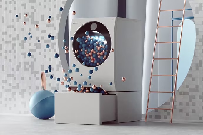 Tvättmaskin från LG SIGNATURE står på ett golv tilllsammans med färgglada bollar och bubblor.