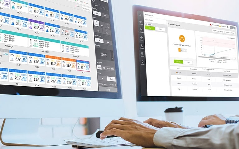 An Image of someone using dual monitors for seasonal energy management.