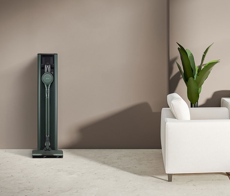 It shows calming green color LG CordZero All-in-One Tower Objet Collection is placed in a brown-tone modern living room.