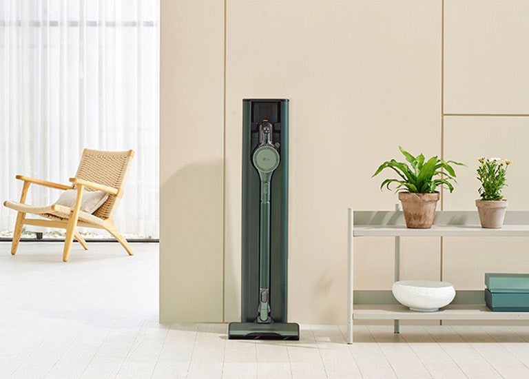 It shows calming green color LG CordZero All-in-One Tower Objet Collection is placed in a modern living room.