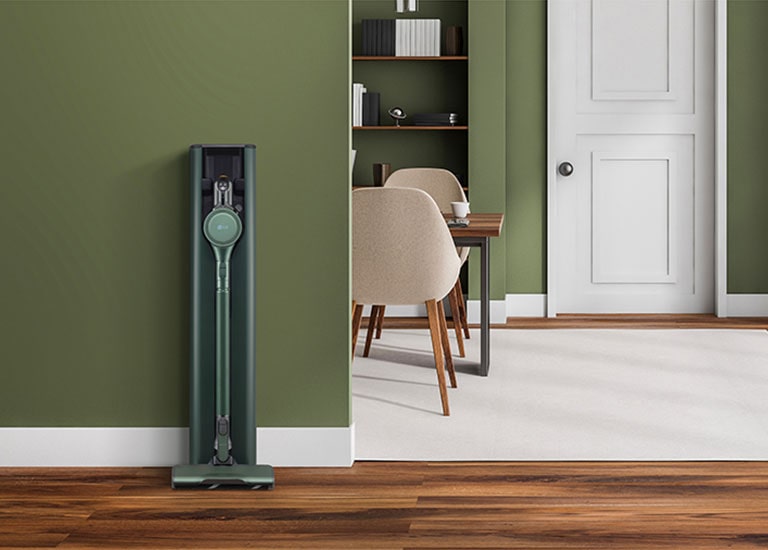 It shows LG CordZero All-in-One Tower Objet Collection is placed in a green-tone modern living room.