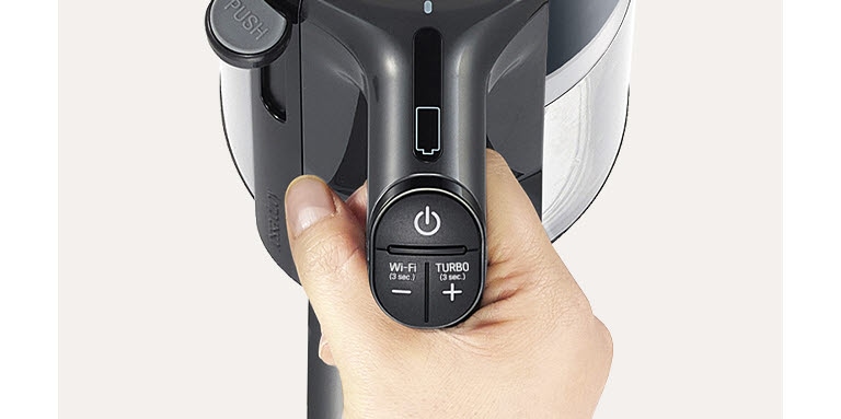 It shows the vacuum cleaner handle and the button on the handle.