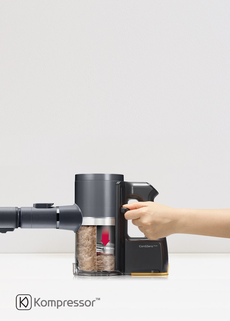 It shows the scene of compressing the dust in the vacuum cleaner head.