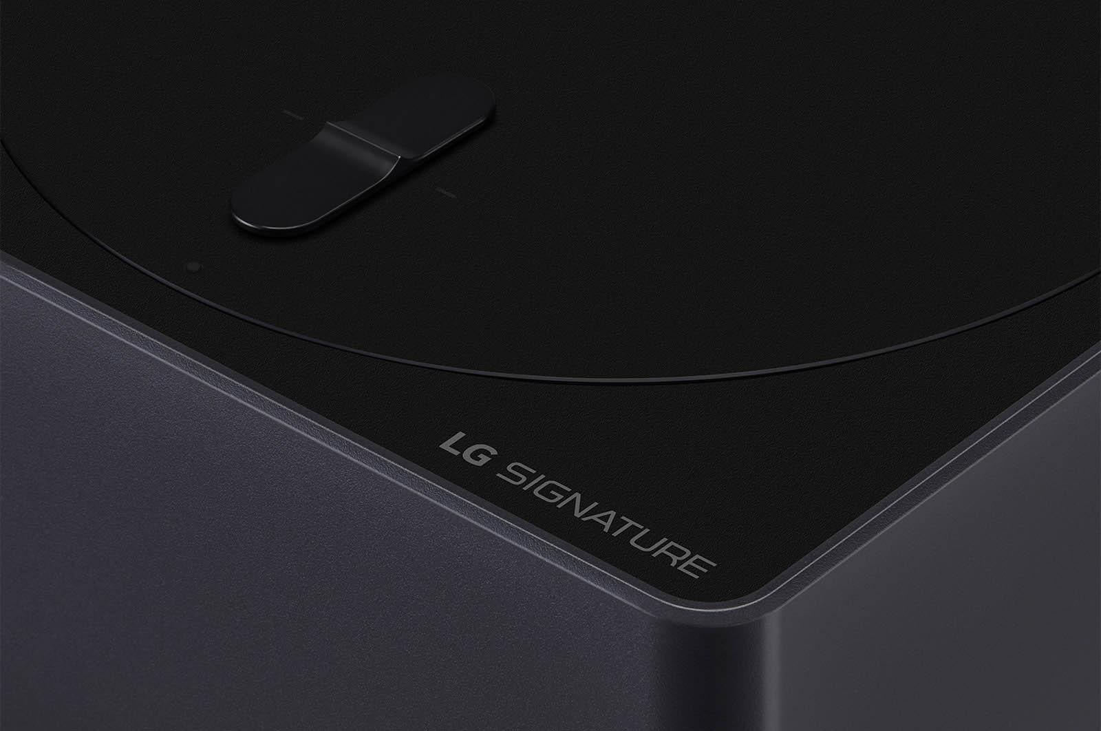 Slightly-angled close-up of the Zero Connect Box with the LG OLED logo on the edge