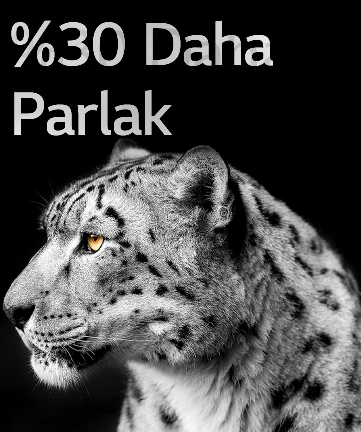 Görüntünün solunda beyaz bir leoparın yüzü yandan görünüyor. Solda “%30’a kadar daha parlak” yazısı görünüyor.