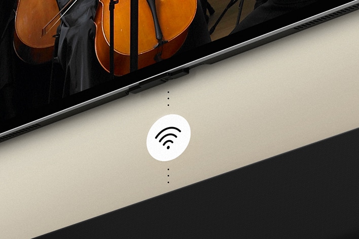 Görüntüde LG OLED TV ile Soundbar ve ortada beyaz bir Wi-Fi sembolü grafiği yer alıyor.
