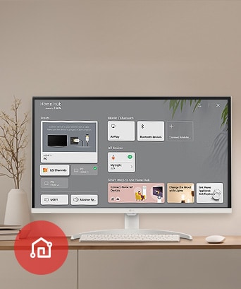 桌上的顯示器展示主儀表板畫面，左下角展示 LG ThinQ 應用程式圖示。