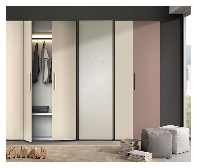 It shows LG Styler Objet Collection stood with built-in closet in dressing room.