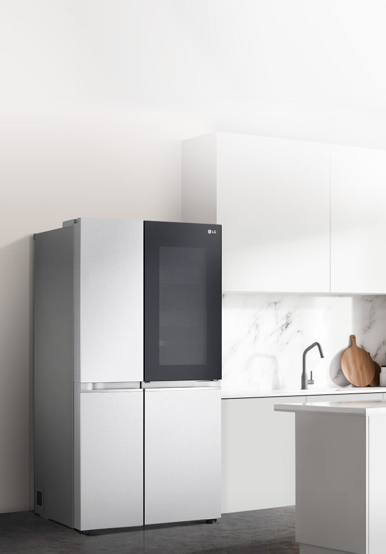 A side view of a kitchen with a black InstaView refrigerator installed.