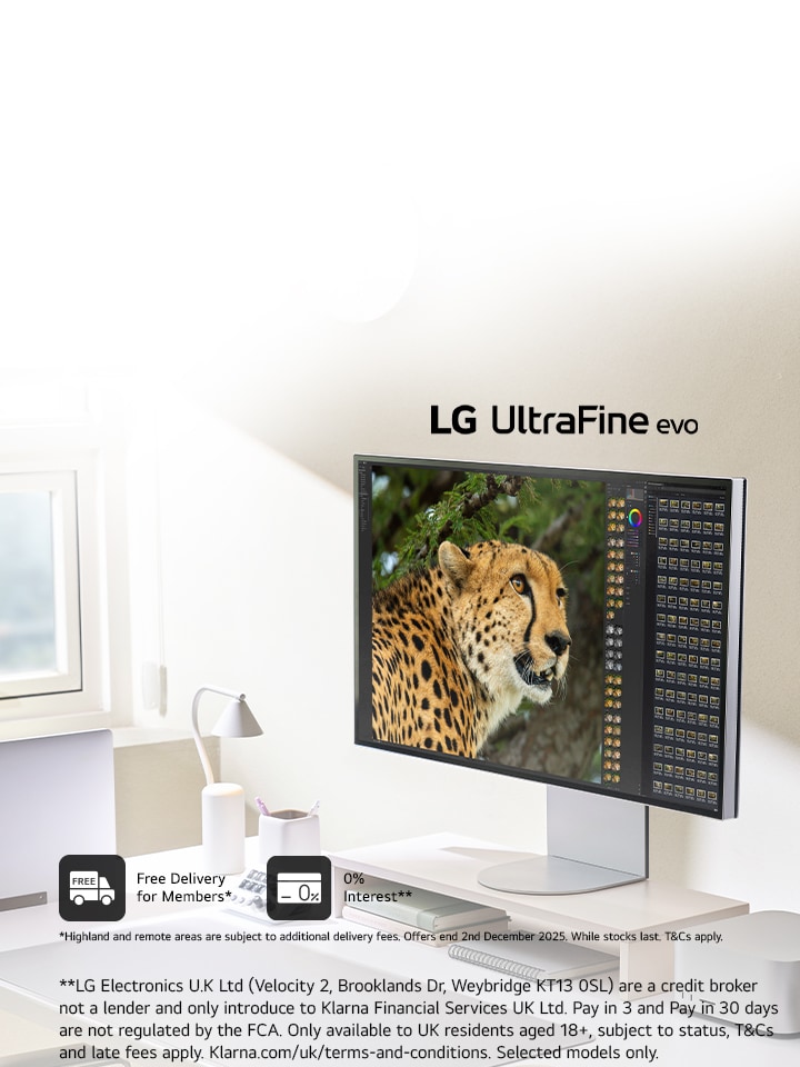 A home office desk setup up with an LG 6K monitor