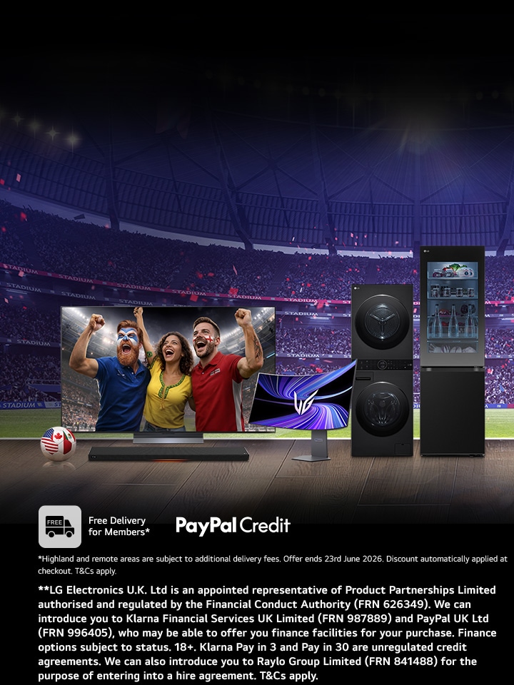 lg oled tv with 3 people celebrating football world cup as a screenfill with lg washtower and fit and max fridge and an monitor on a stand