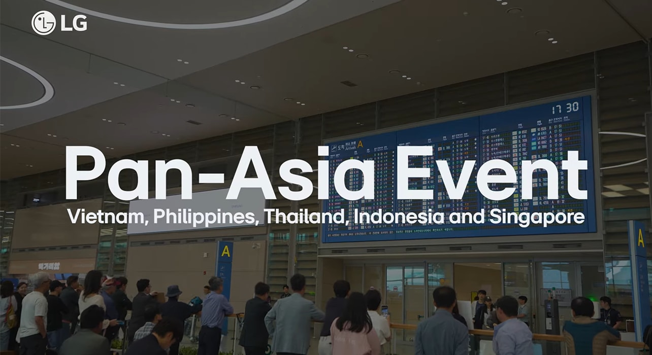 Pan-Asia Event hosted by LG, featuring Vietnam, Philippines, Thailand, Indonesia, and Singapore. People are gathered in an airport terminal with a large flight information display in the background.	