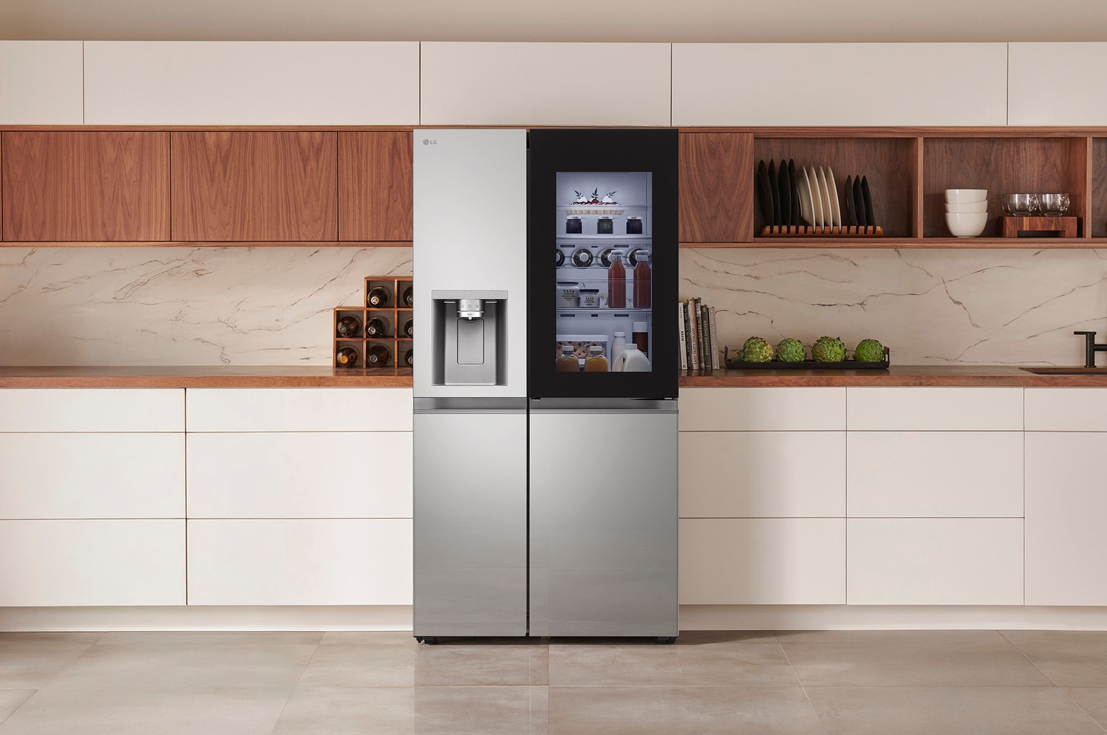 LG Side-by-Side Refrigerator GSXE81PYBD in a stainless steel finish, featuring InstaView™ Door-in-Door® and a dispenser, seamlessly integrated into a modern kitchen with white and wood cabinets.