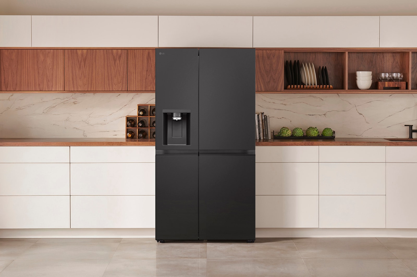 LG Side-by-Side Refrigerator GSLE91EVAB in a matte black steel finish, seamlessly integrated into a modern kitchen with white and wood cabinets, featuring an external water dispenser.