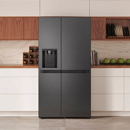LG Side-by-Side Refrigerator GSLC41EPPE in a matte black steel finish, seamlessly integrated into a modern kitchen with white and wood cabinets, featuring an external water dispenser.