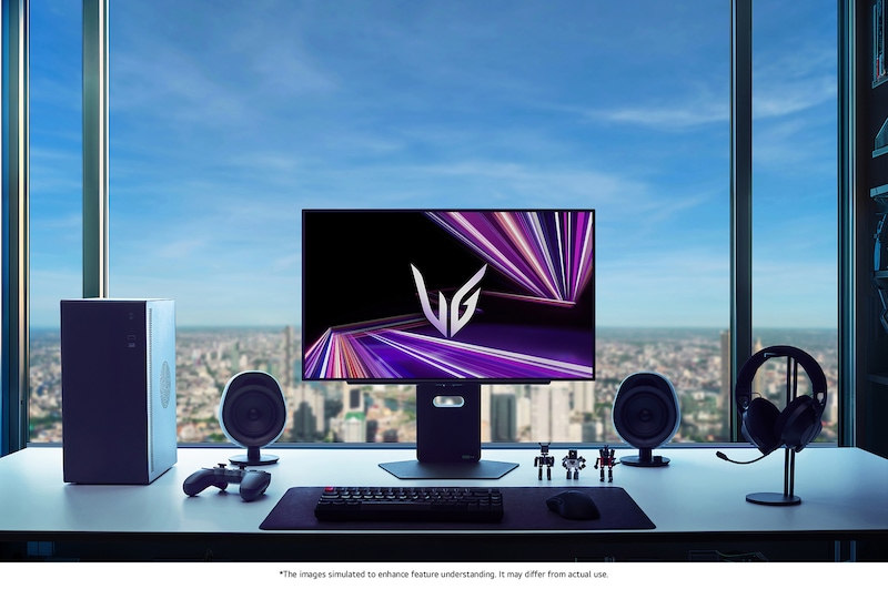 LG Monitor 27GX790A positioned at the center of a premium gaming setup, featuring a dark room ambiance with a city skyline view and optimized peripherals for immersive gaming.