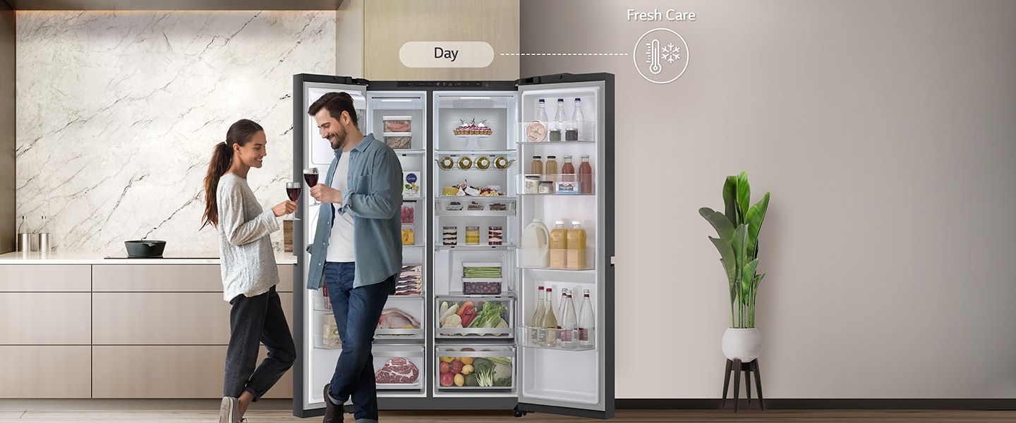 On the left side, The refrigerator is open and the couple is standing near the refrigerator the time seems to be evening on the right side with the energy-saving icon.