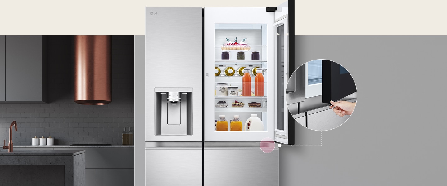 The front view of a black InstaView refrigerator. The door-in-door of the refrigerator is open. There's a small screen that explains where a concealed opening button is to open the door.