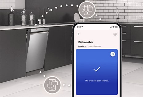 A silver LG freestanding dishwasher that is partially opened in the modern style kitchen and LG thinq app showing cycle completion notification.	