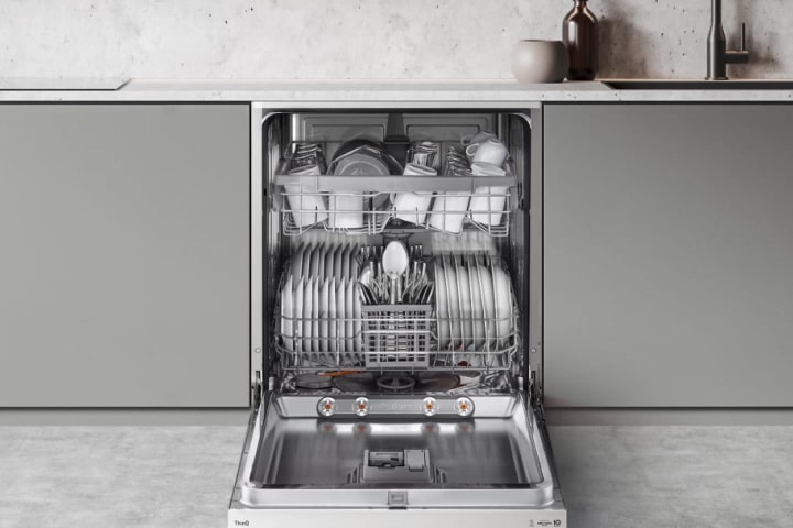 Footage of intense water streams from rotating dishwasher blades in close-up.