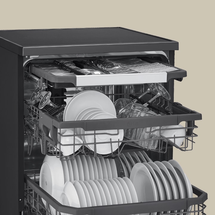 Showcasing how spatulas, spoons, forks, and knives are arranged in the 3rd rack of an LG free-standing dishwasher.